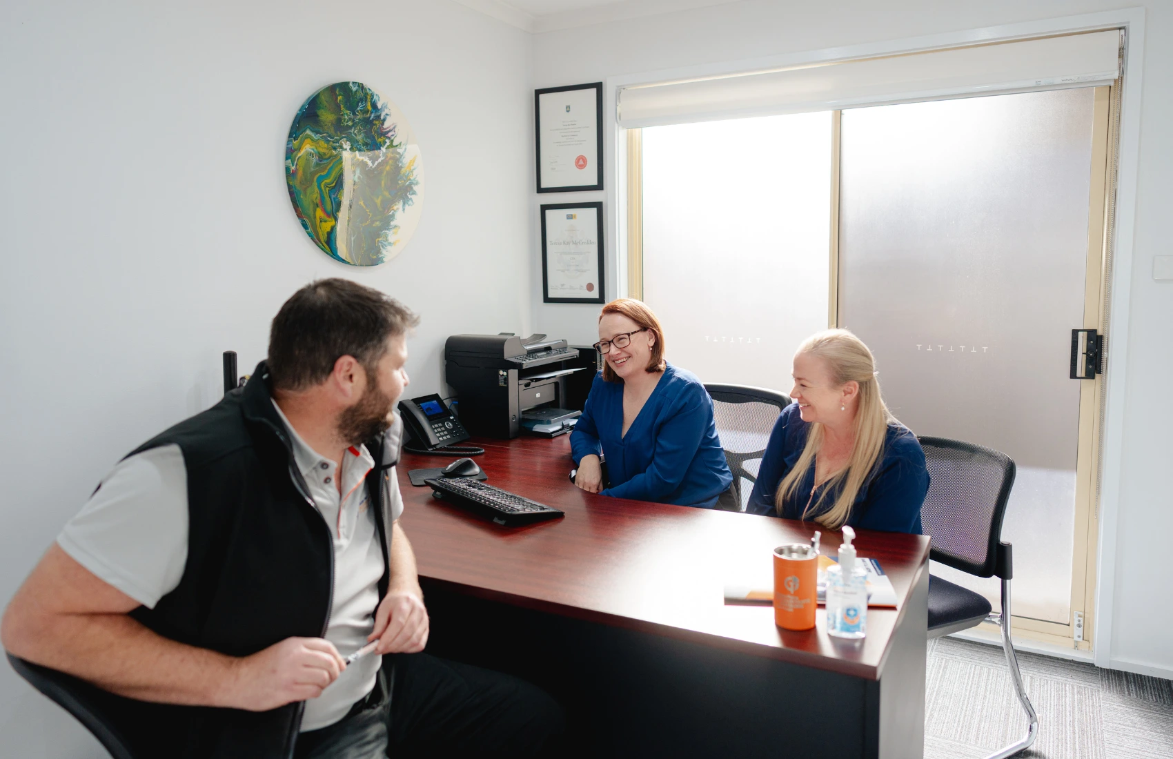 Happy clients sharing success stories with Golden Plains Accountants after achieving financial goals